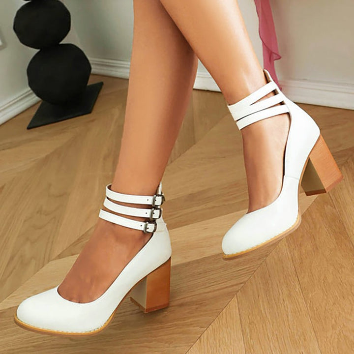Black suede block-heel pump with triple ankle straps, angled product view