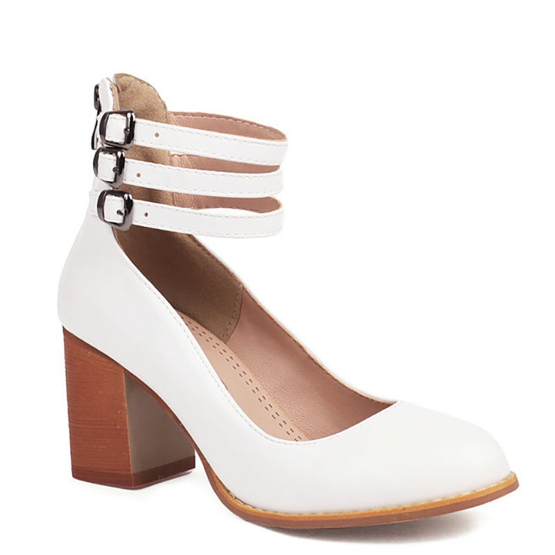 Side view of white leather pump with buckled ankle straps and block heel