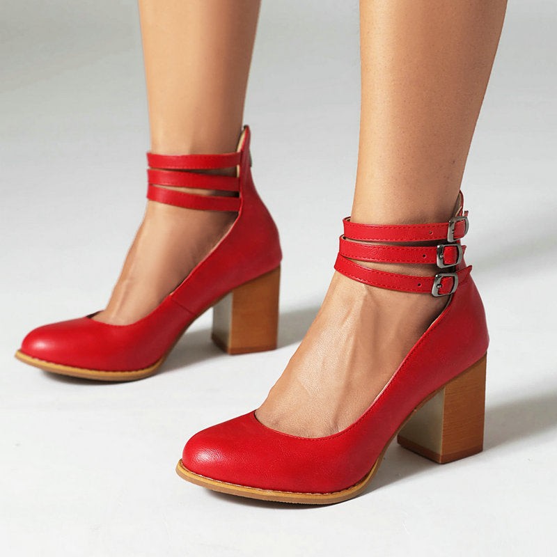 White leather block-heel pump with triple ankle straps, angled product view