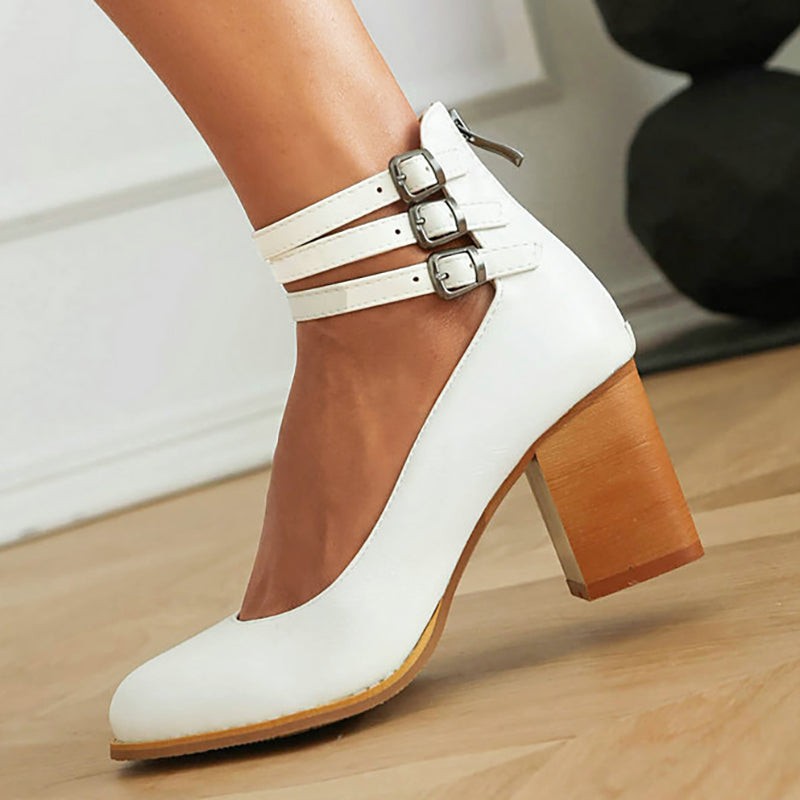 White leather block-heel pump with triple buckled ankle straps, close-up detail