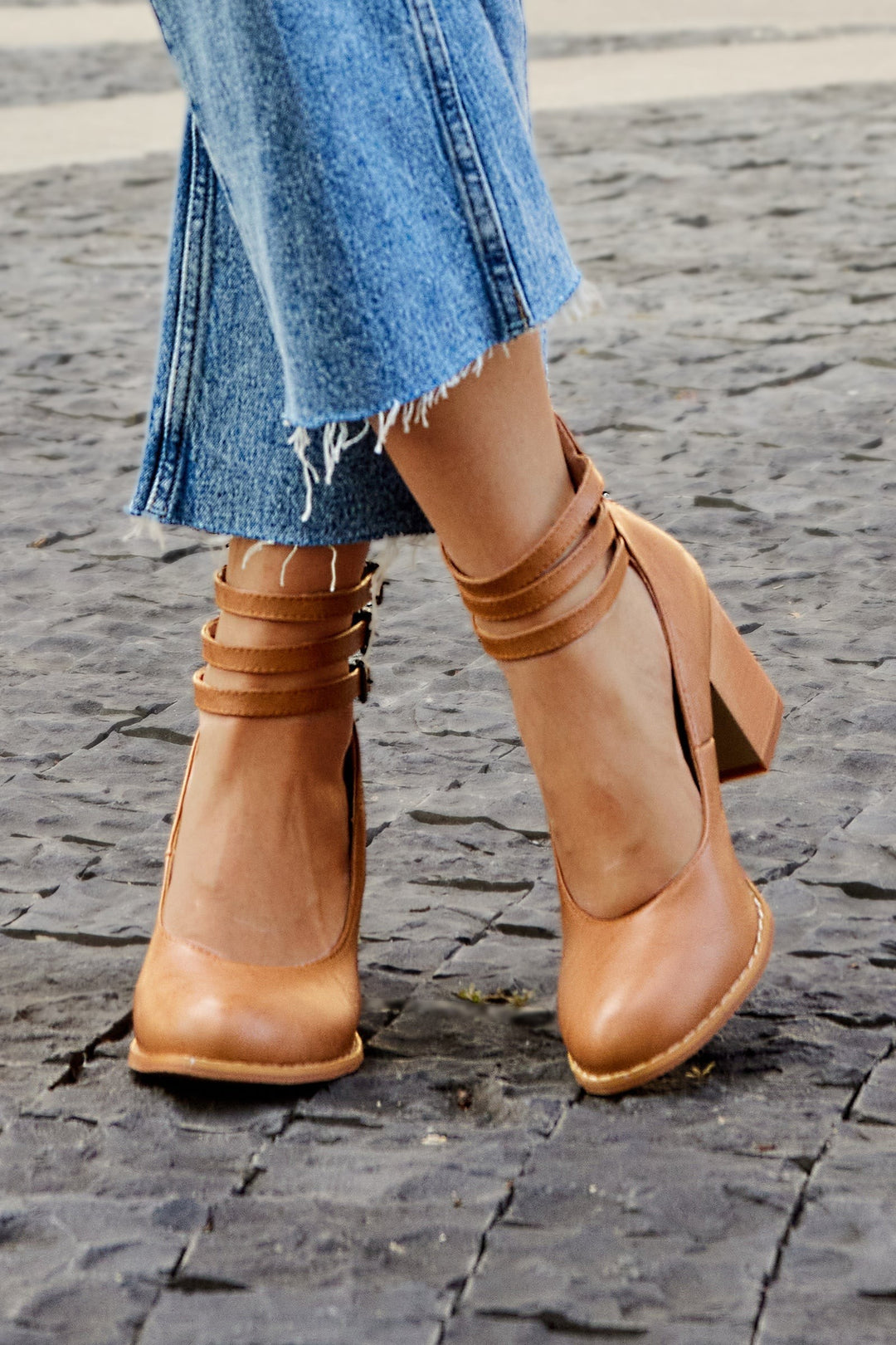 Camel leather block-heel pumps with strappy ankle buckles, close-up rear view
