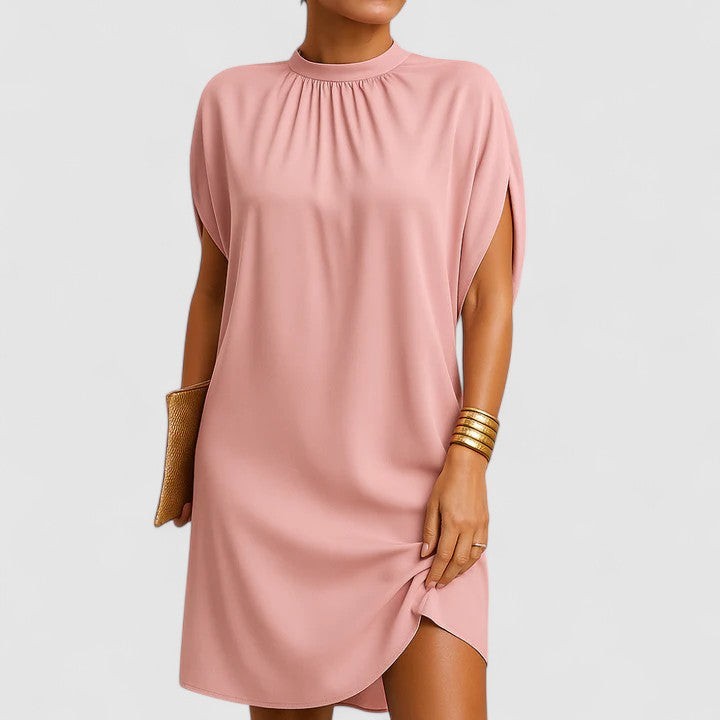 Pink mock neck shift dress with split cap sleeves and curved hem