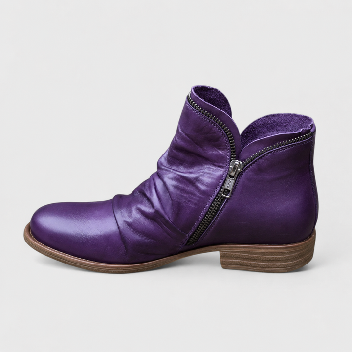 Purple leather ankle boot with ruched vamp and side zipper detail
