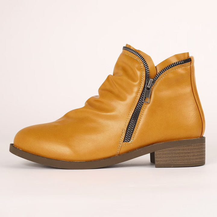 Mustard yellow ankle boot with scrunched leather upper and side zip