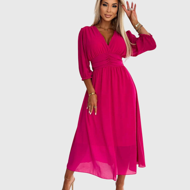 Hot pink chiffon wrap dress with V-neck and ruched waistband on model