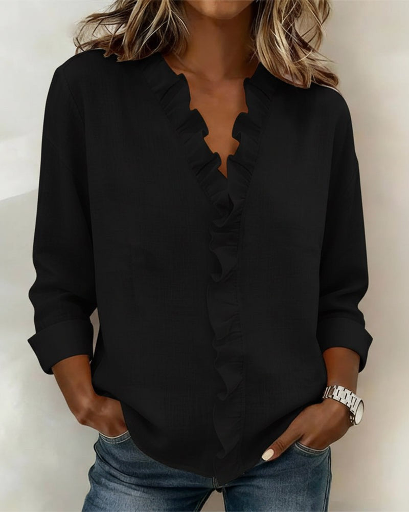Black ruffle V-neck blouse with long sleeves and relaxed fit