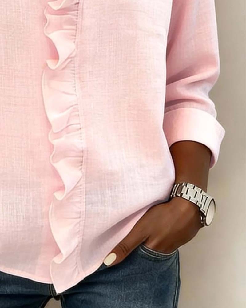 Pink blouse cuffed sleeve detail with ruffled front trim