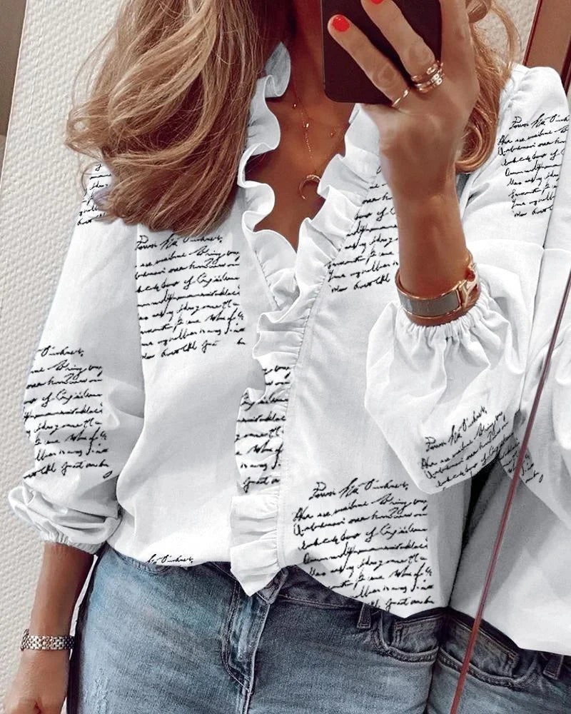 white script print ruffled blouse with V-neckline