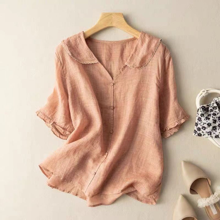 Blush pink linen blouse featuring scalloped collar and button-front closure