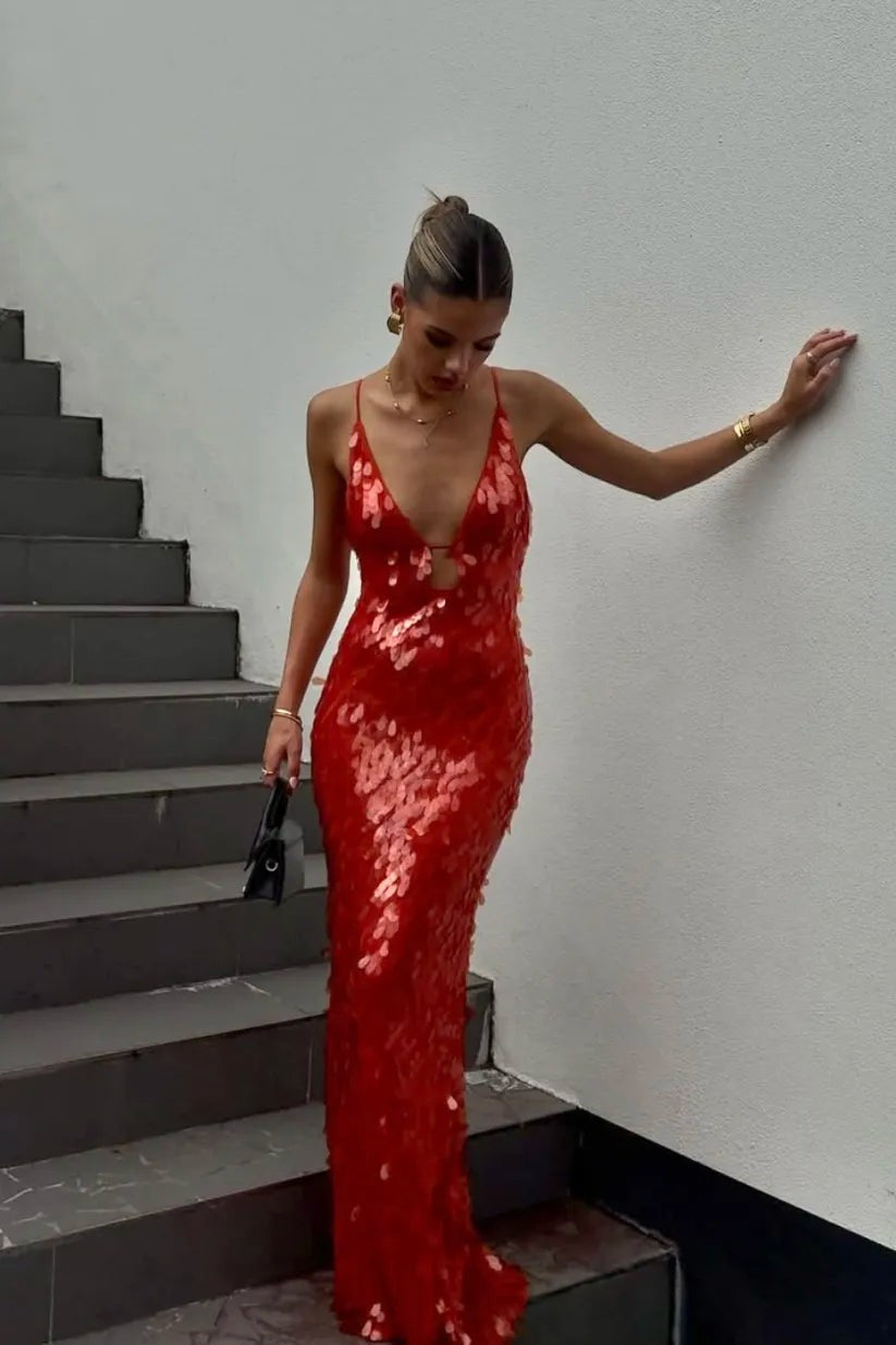 red sequin maxi dress with plunging neckline and thin straps on staircase