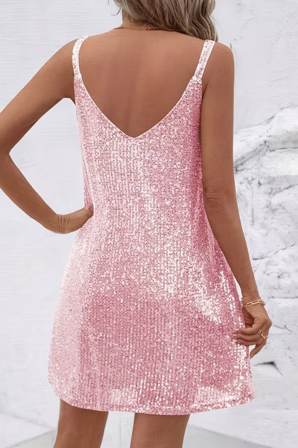 Back view of pink sequin mini dress showing V-back and thin straps