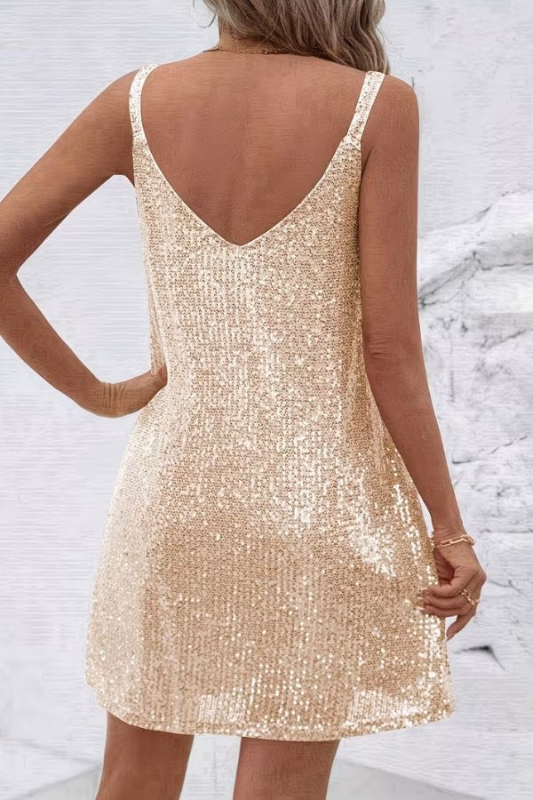 Back view of gold sequin mini dress with V-back neckline detail