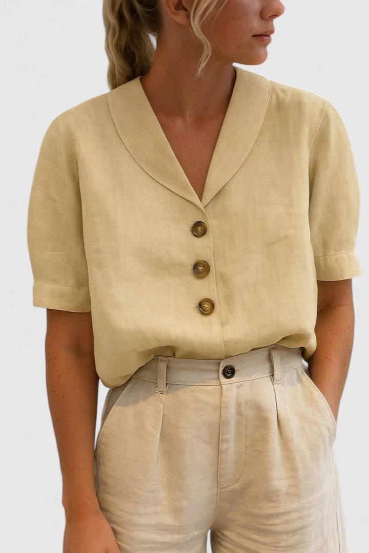 Pale yellow linen blouse with shawl collar and short sleeves, three-button front