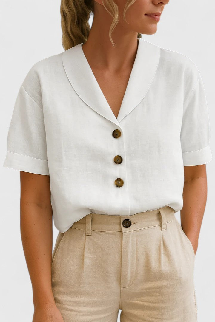 White linen short-sleeve blouse with shawl collar and tortoiseshell buttons