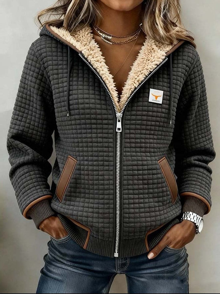 Gray quilted zip-up hoodie with sherpa-lined hood and brown trim
