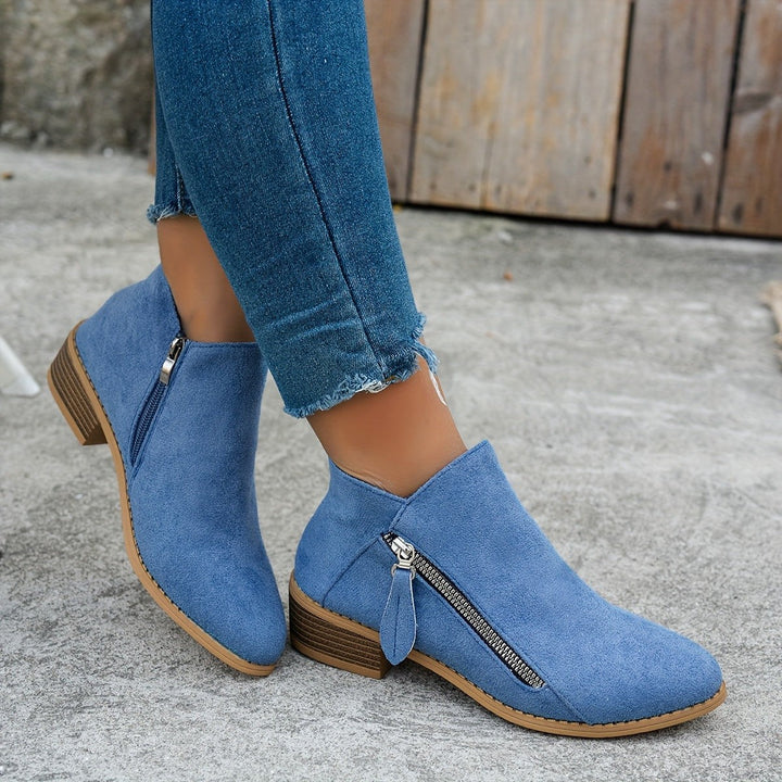Denim blue suede ankle boots worn with matching frayed jeans