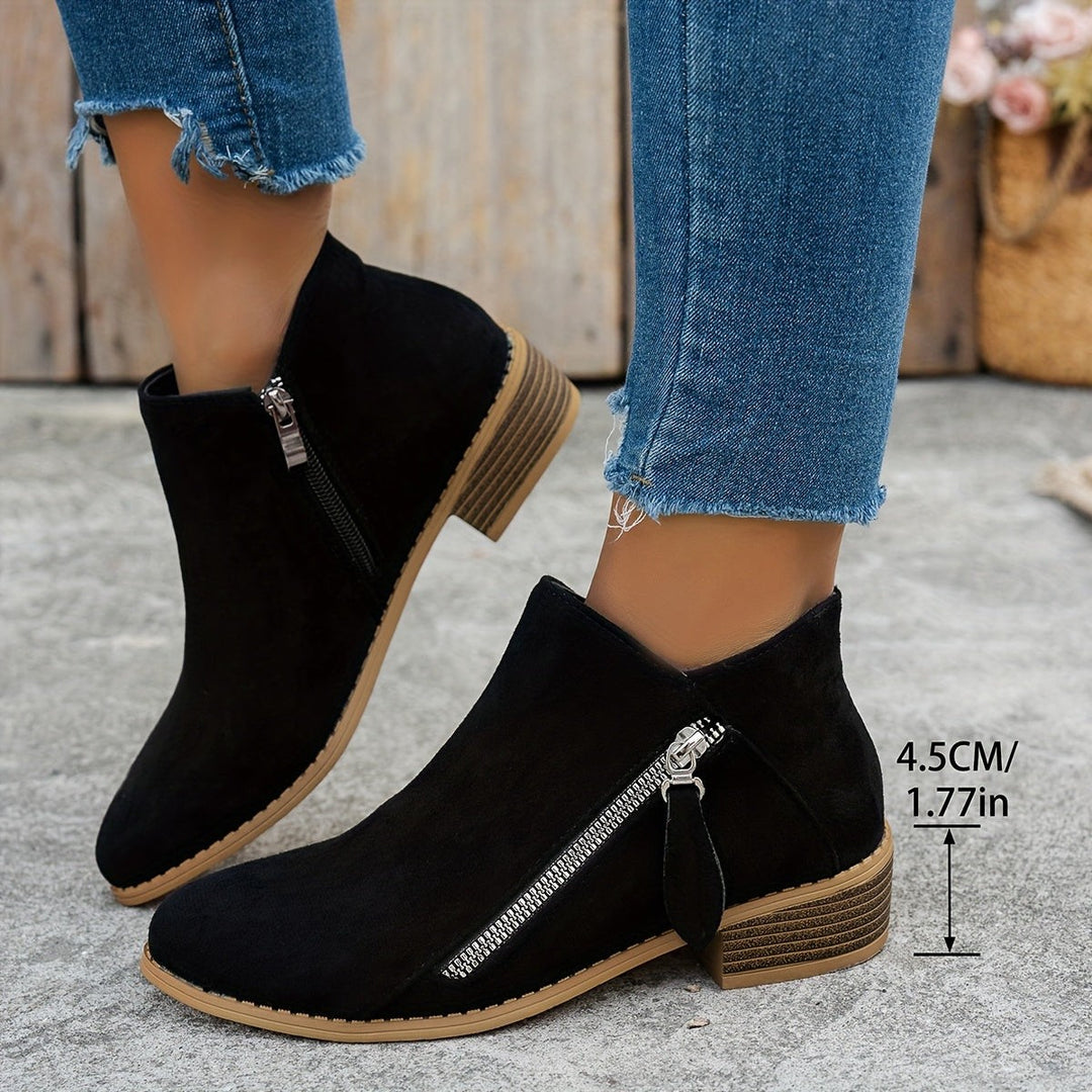 Black suede ankle boots showing heel height measurement of 4.5cm