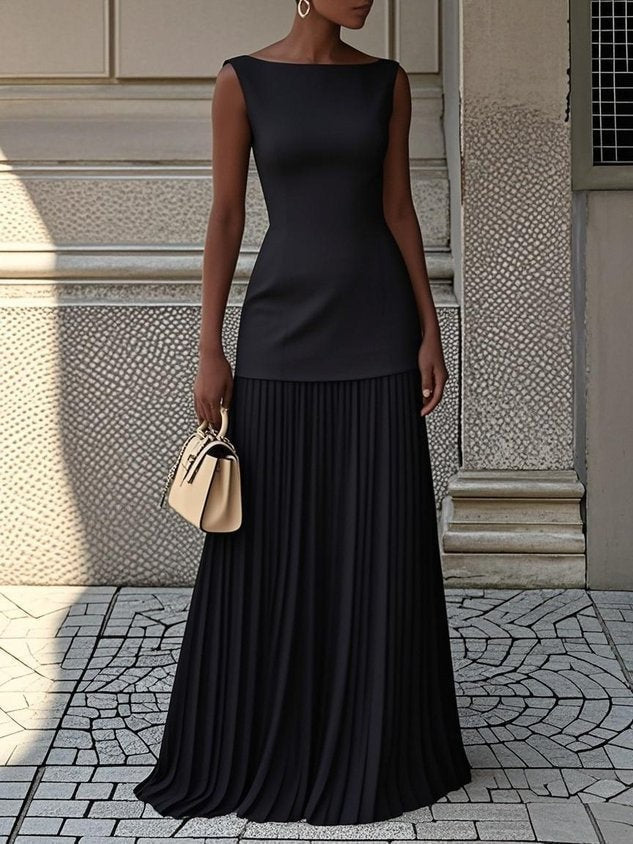 Black sleeveless maxi dress with fitted bodice and pleated flowing hem