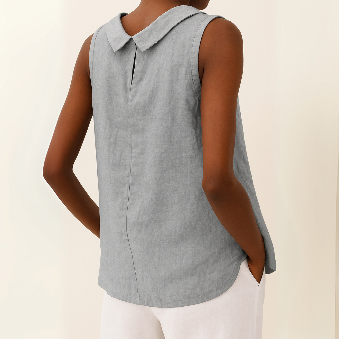 Back view of gray sleeveless blouse with folded collar