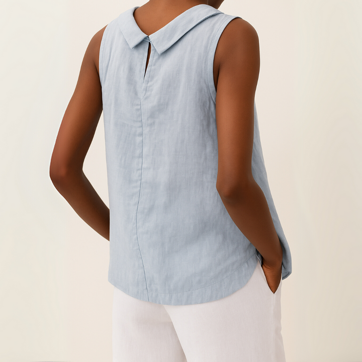 Light blue sleeveless blouse showing keyhole back closure