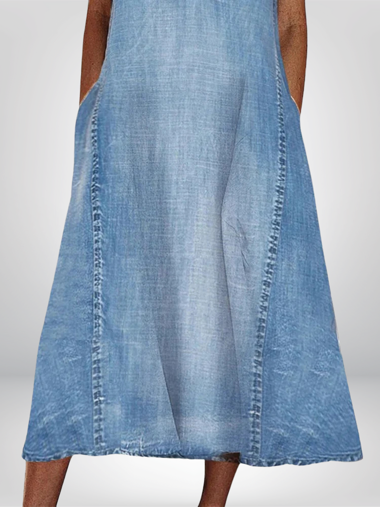 flowy denim dress detail showing side pocket and faded wash texture