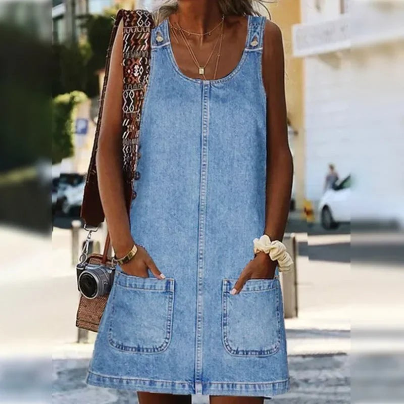 Sleeveless denim overall dress with front patch pockets and button straps