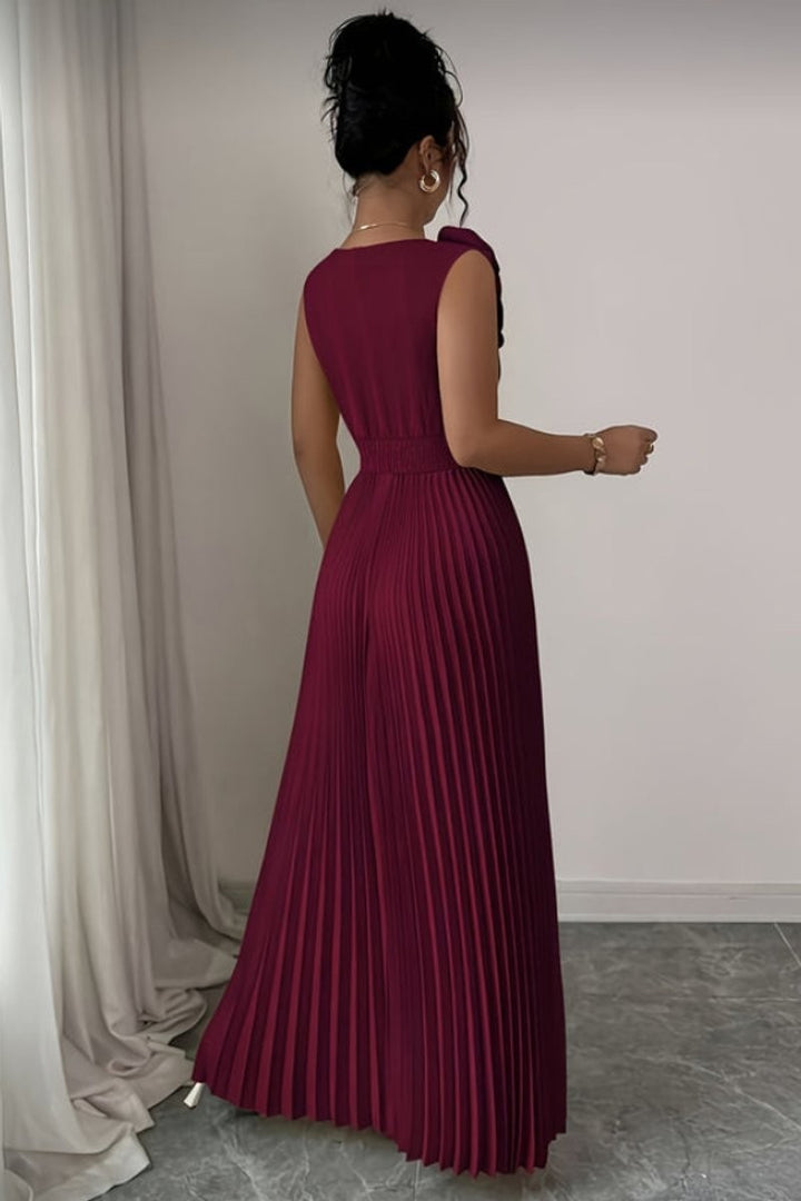 burgundy pleated maxi dress with shoulder bow, back view flowing silhouette