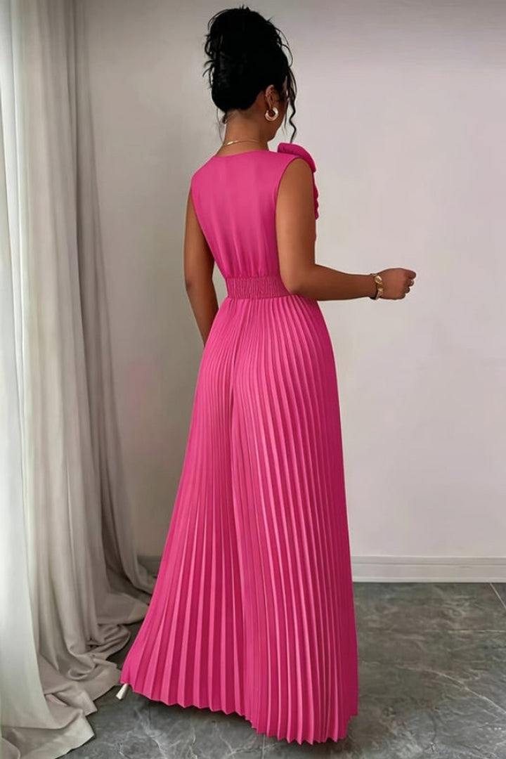hot pink sleeveless pleated maxi dress with bow detail, back view