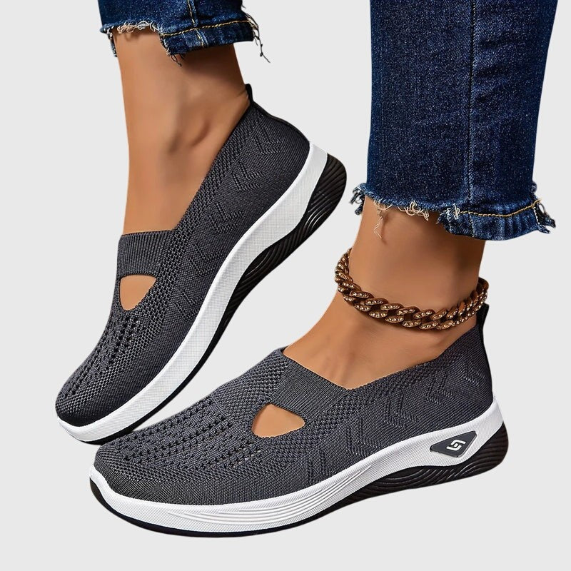 Charcoal gray mesh slip-on sneakers with cutout detail and white sole