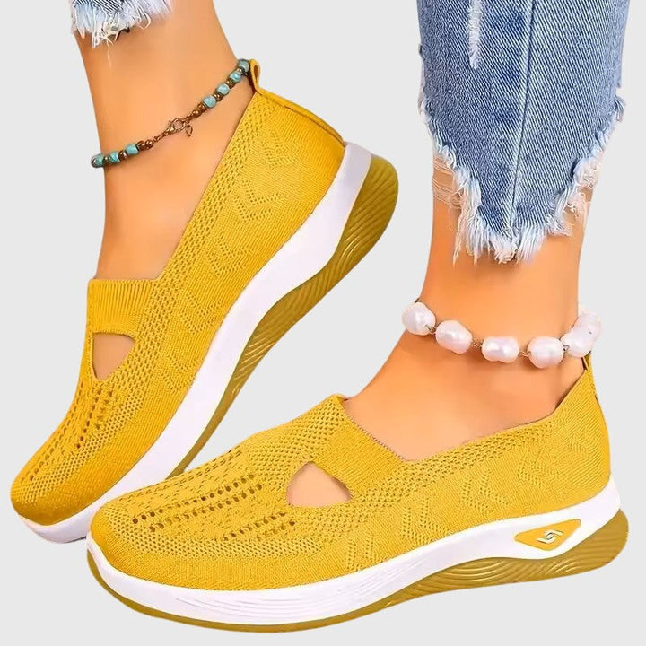 Mustard yellow knit slip-on sneakers with cutout design and white platform sole