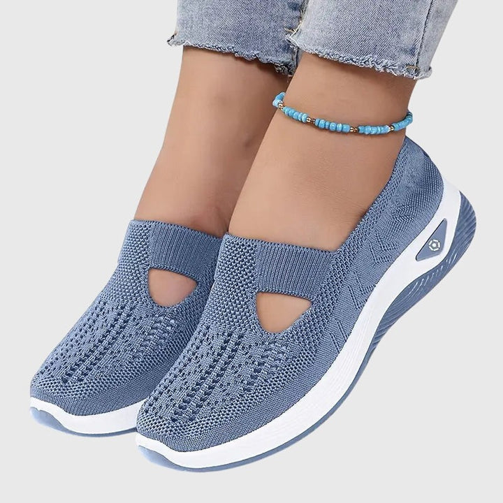 Dusty blue knit slip-on shoes with triangle cutout and thick white sole