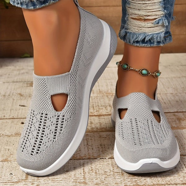Gray mesh slip-on sneakers featuring triangle cutout and chunky white sole