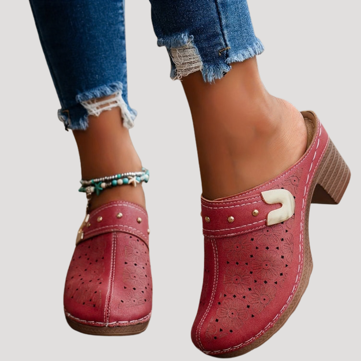 red laser-cut leather clog mules with buckle detail and chunky heel