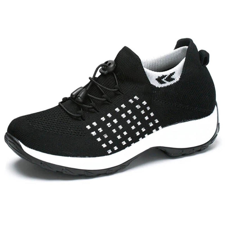 black knit sneakers with white polka dot pattern and lace-up toggle