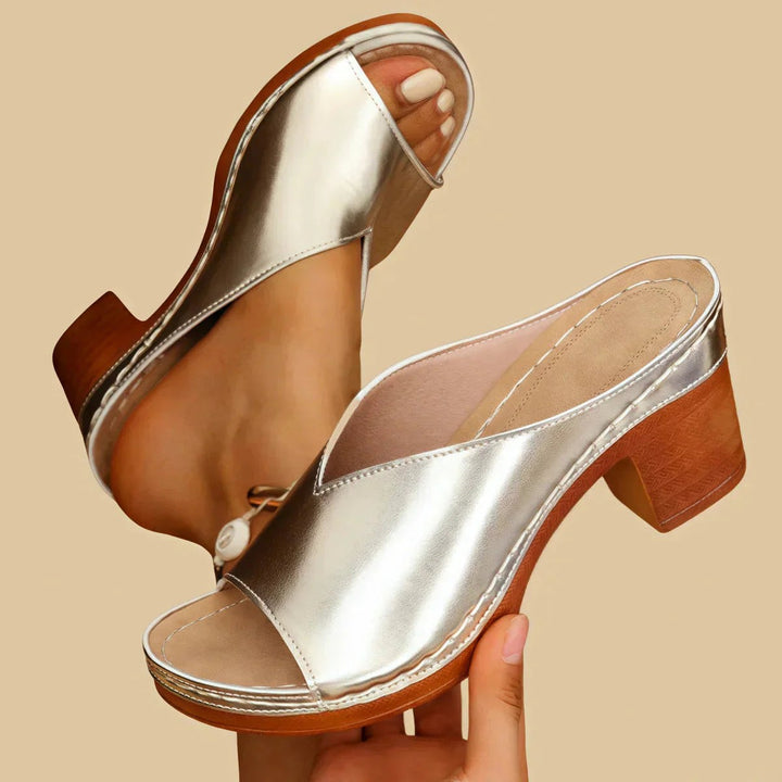metallic silver peep-toe mule sandals with chunky wooden block heel
