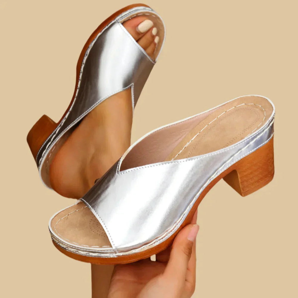 silver leather slip-on sandals featuring stitched platform and stacked heel