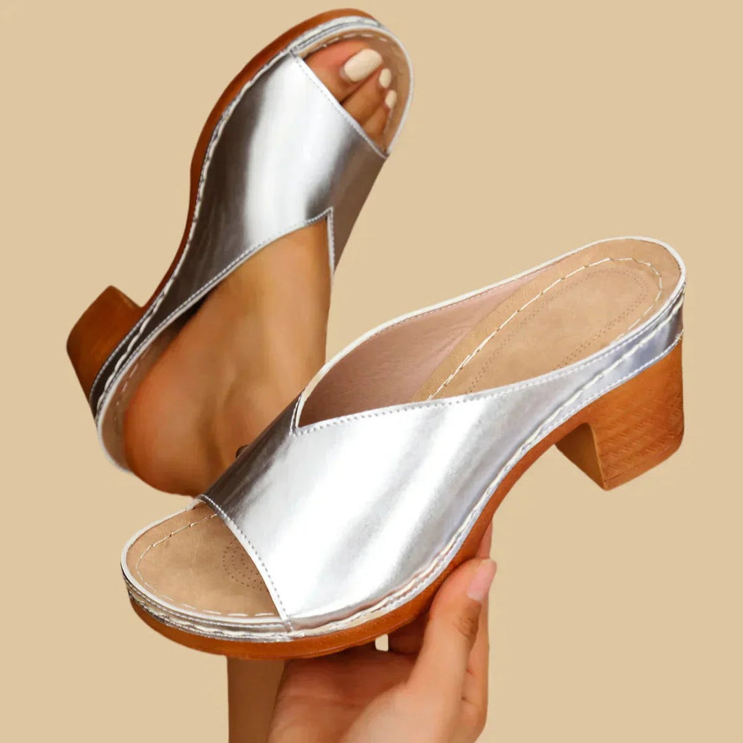 silver leather slip-on sandals featuring stitched platform and stacked heel