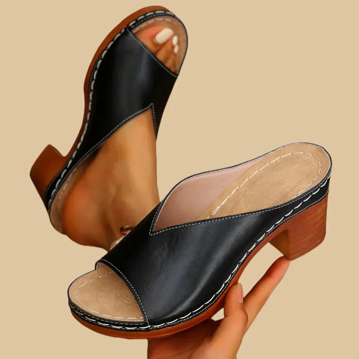 black leather slide sandals with topstitched vamp and chunky heel