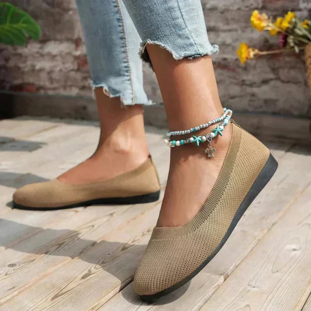 Tan knit ballet flats worn with cropped jeans and beaded starfish anklet