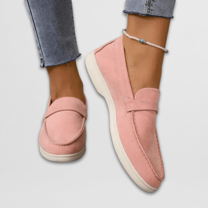 Blush pink suede slip-on loafers with cushioned white sole