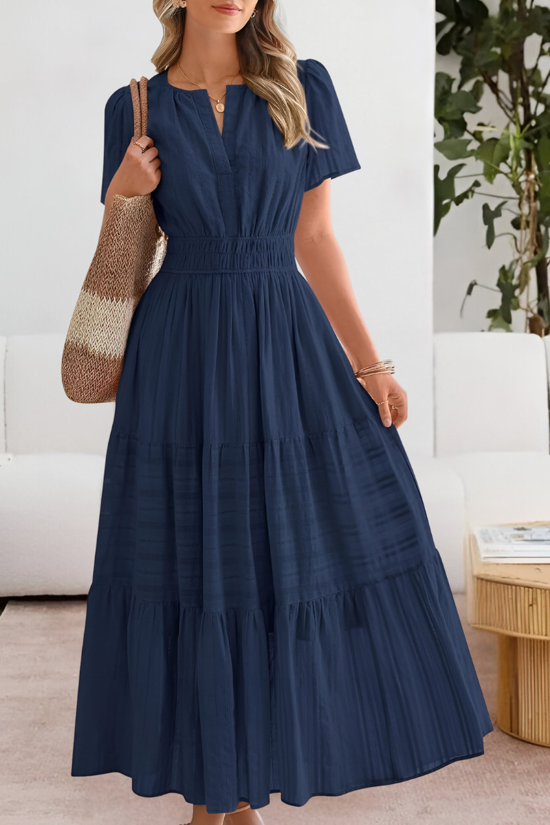 navy blue tiered maxi dress with split neckline and puff sleeves