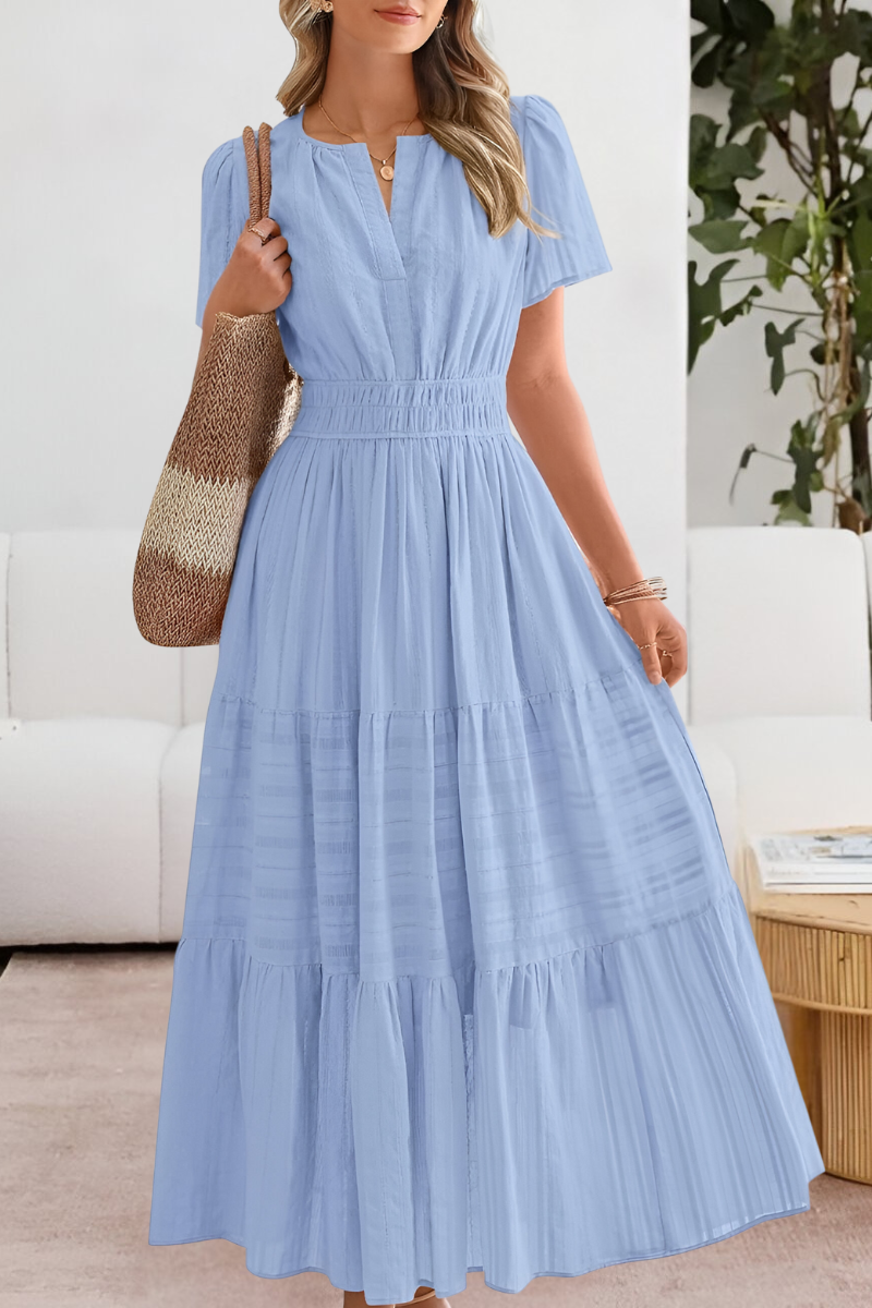 light blue tiered maxi dress featuring smocked waist and flutter sleeves