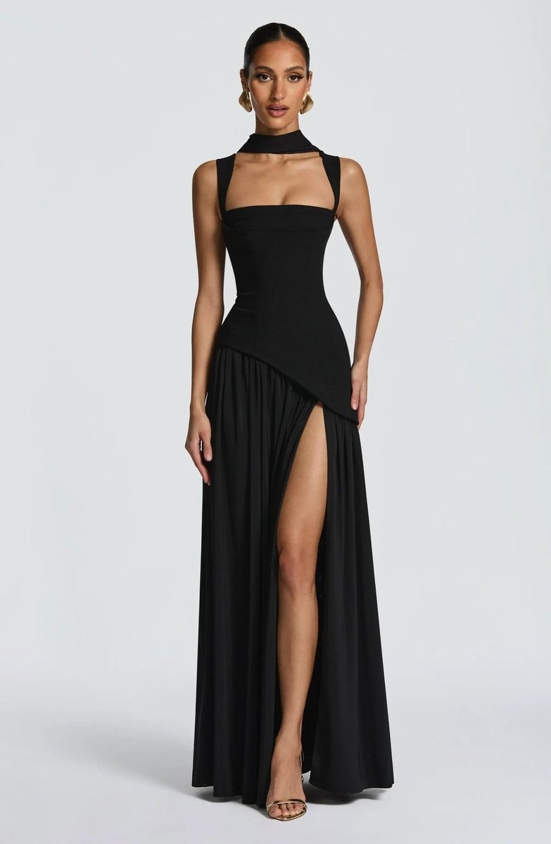 Black halter maxi dress with cutout neckline and dramatic leg slit