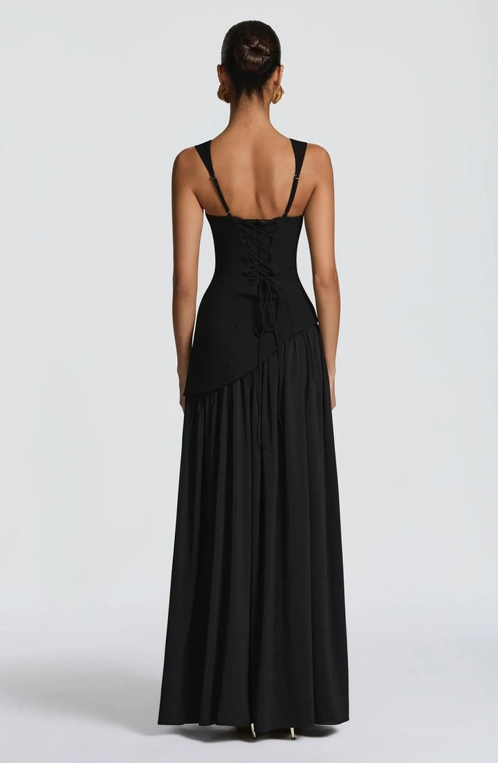 Black maxi dress back view showing lace-up corset detail and full skirt