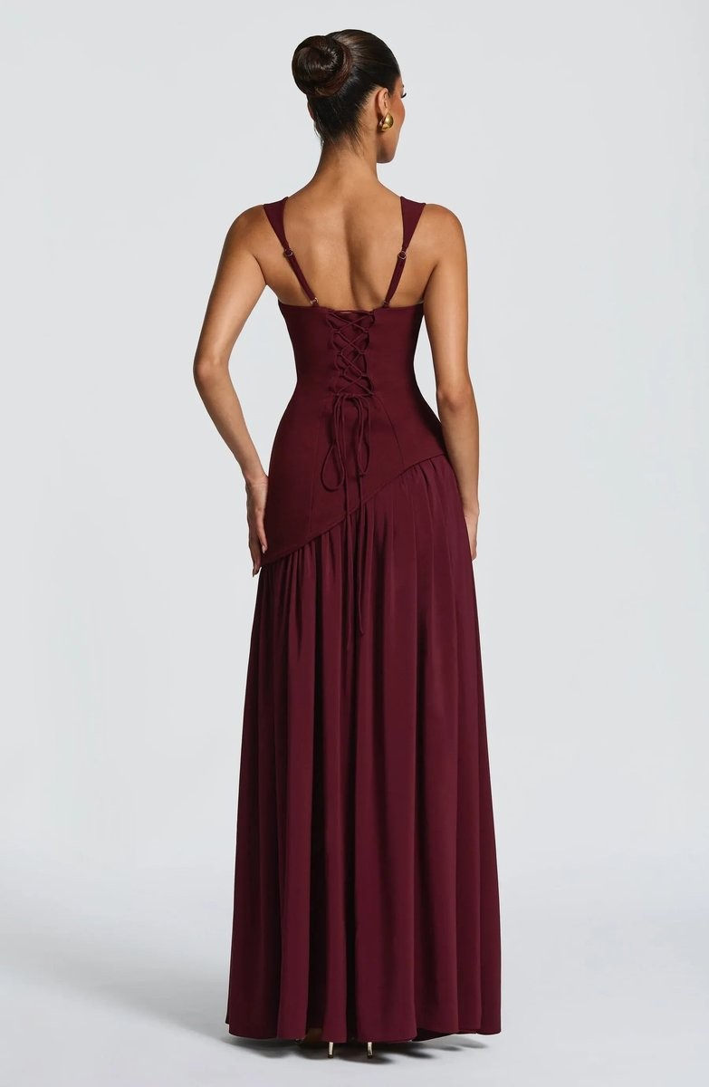Burgundy evening gown back view featuring corset lacing and A-line hem