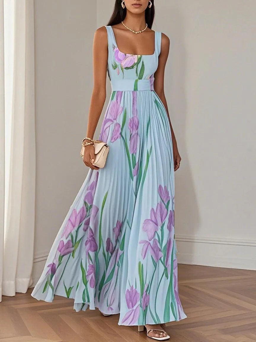 Pale blue pleated maxi dress with lilac floral pattern and belted waist