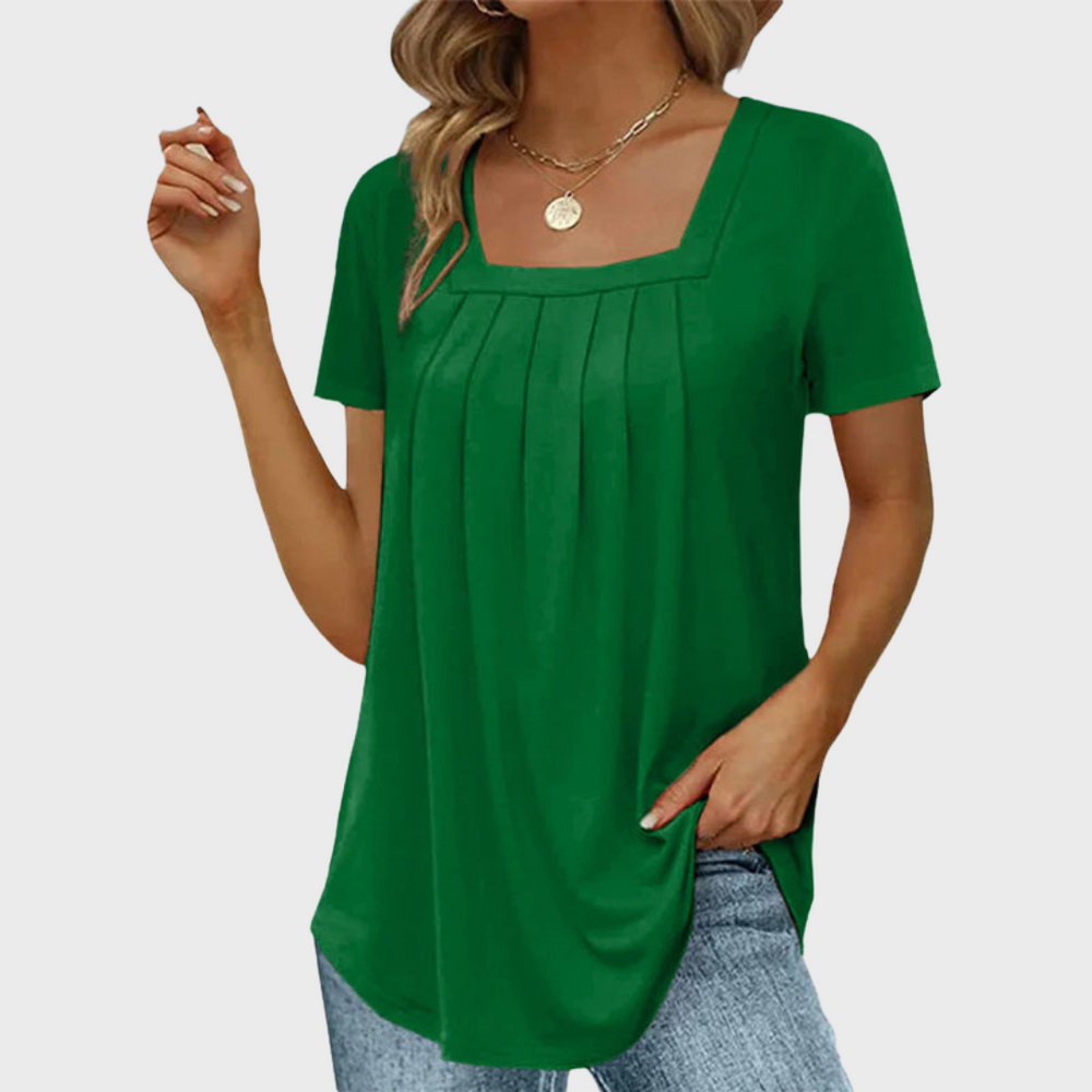 Green square-neck tunic top featuring front pleats and curved hem