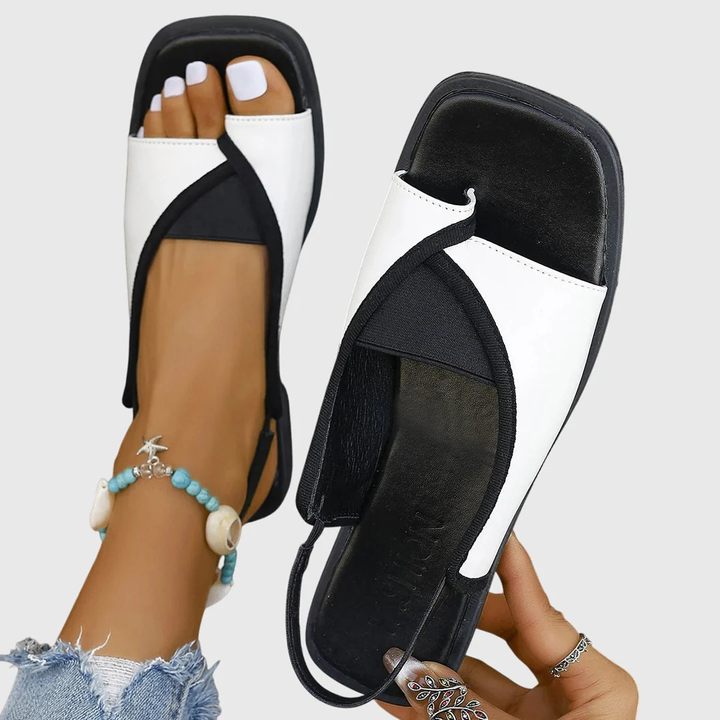 white and black slingback flat sandals with square open toe design