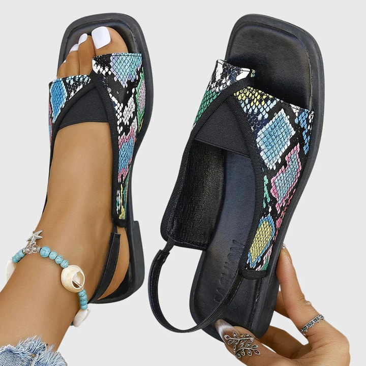 snakeskin print slingback sandals with black elastic strap and open toe