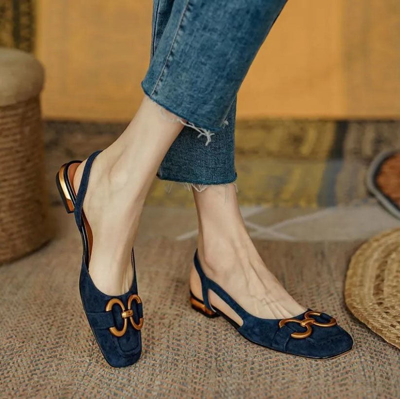 Navy suede slingback flats with gold buckle detail and low block heel